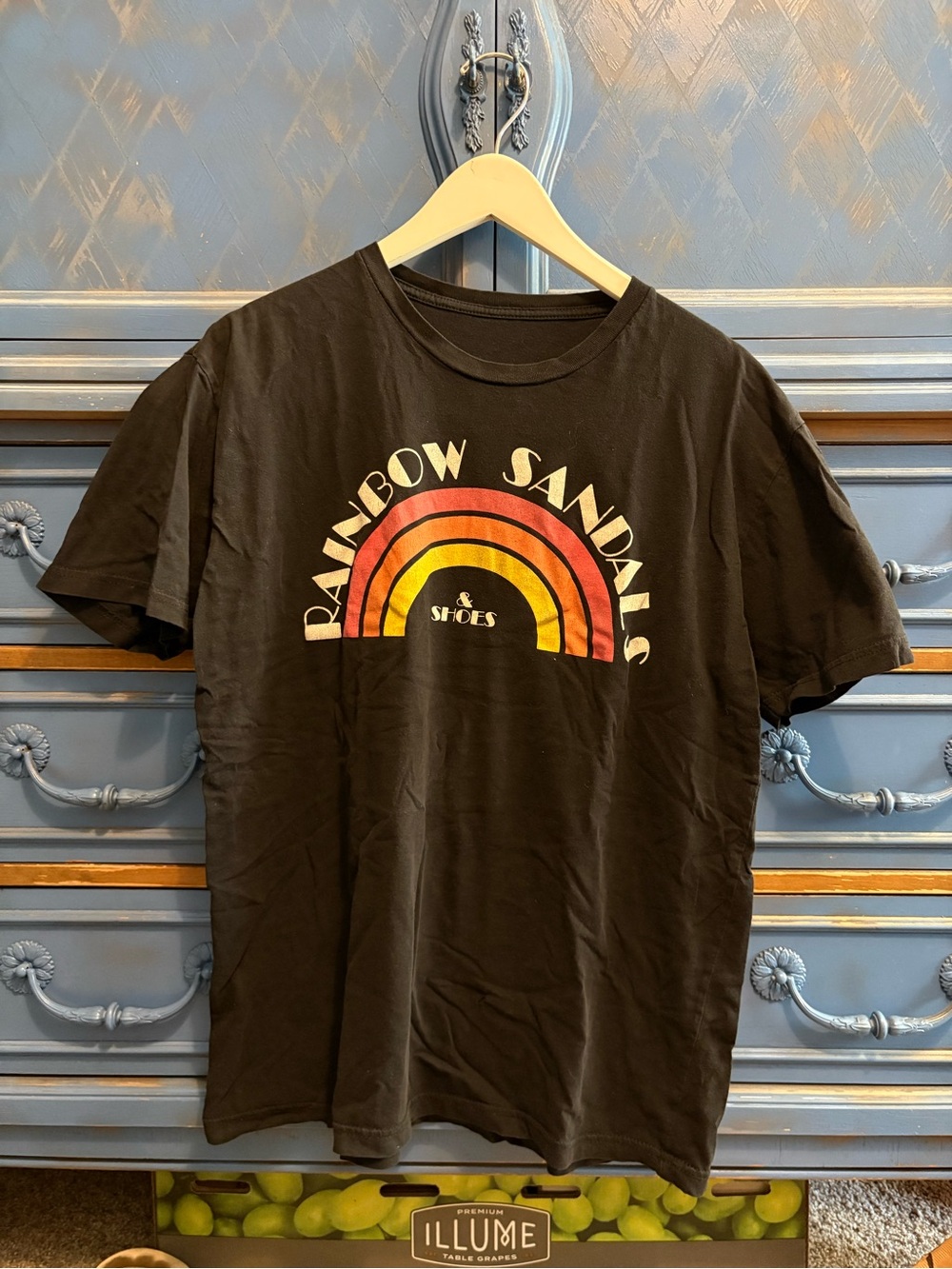 Rainbow Sandals Black Graphic Tee with Red-Orange-Yellow Arch - Rainbow